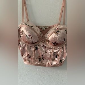 pink top with floral print in size M